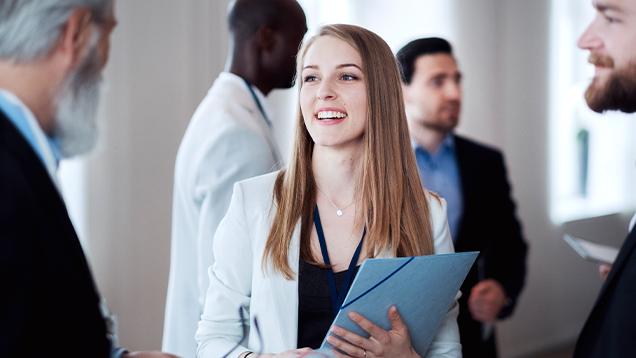 Group of business people talking at a networking event