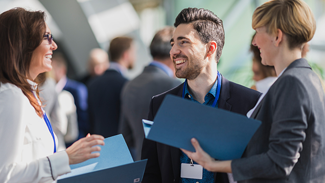 Group of professionals talking at a job fair