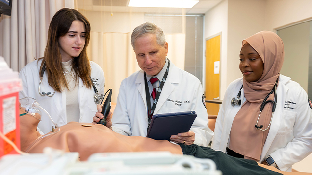 NSU doctors use medical equipment on a manikin