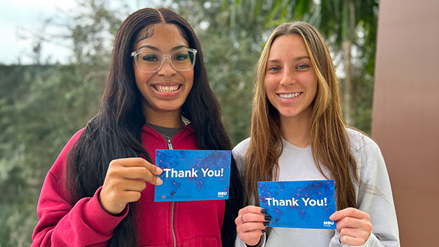 NSU students holding thank you cards