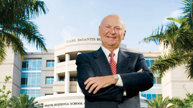 Wayne Huizenga in front of the College of Business