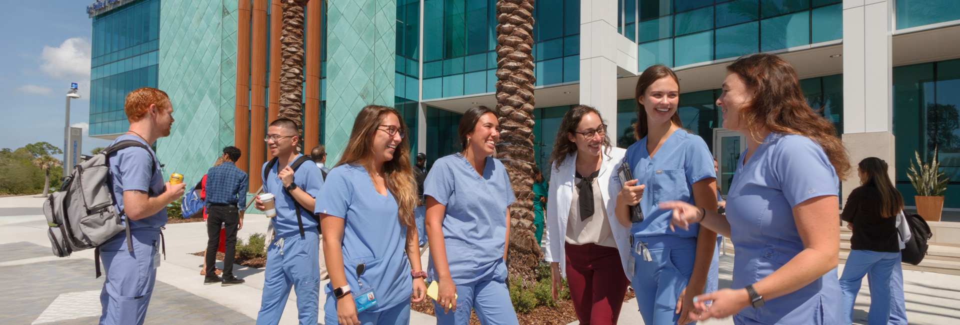 Health care students at outdoors of Tampa bay regional campus