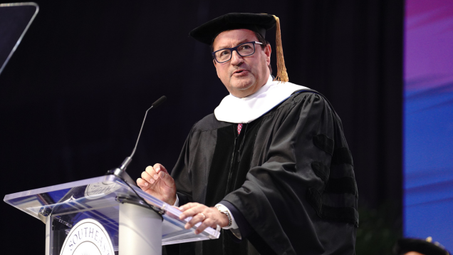 Professor Rowan Parks speaking at NSU commencement ceremony