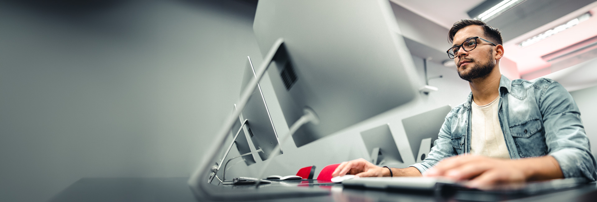 NSU student in classroom using computer