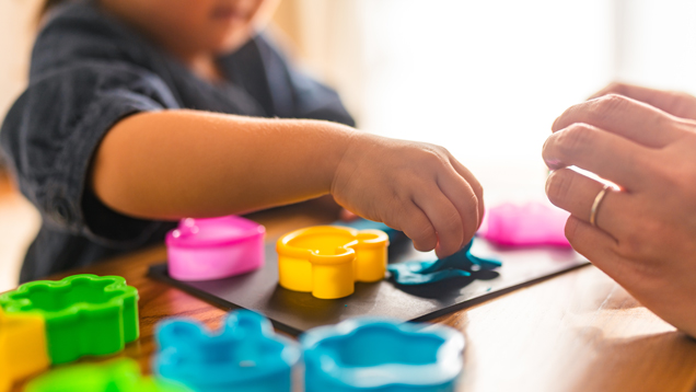 Child care professional with kid closeup