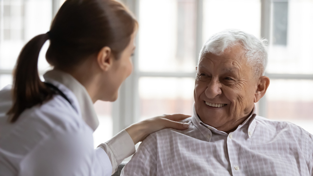 Geriatric nurse with patient