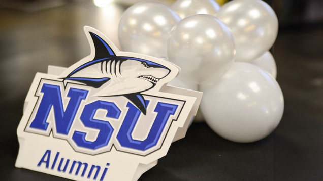 NSU alumni sign and balloons at event closeup
