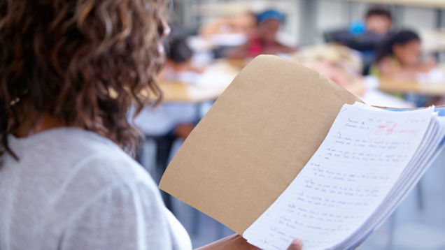 Teacher reading out student marks