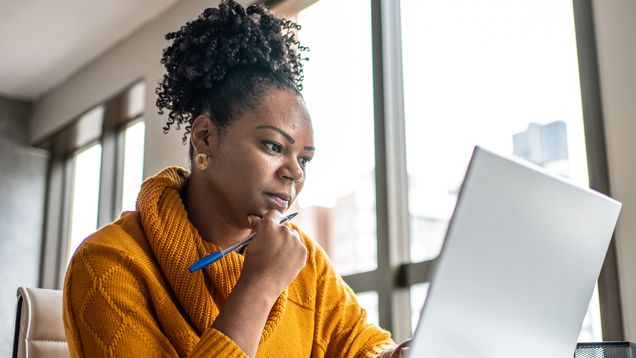 Woman concentrated using computer