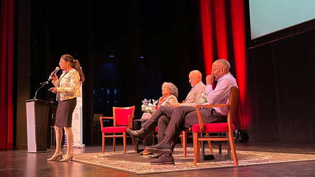 People on stage at ADRC conference 2022