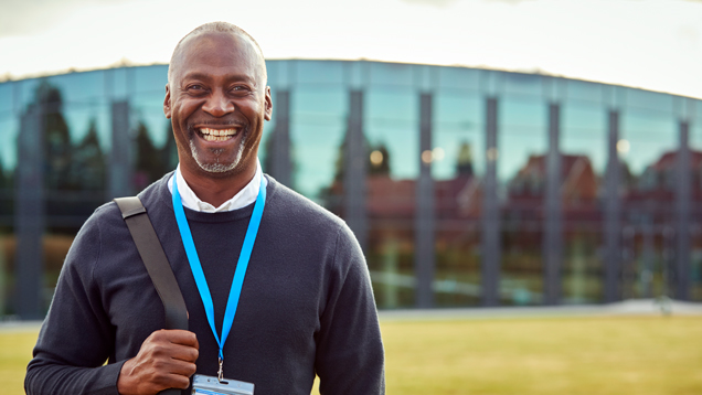 Portrait of male university finnancial aid advisor on campus outdoors