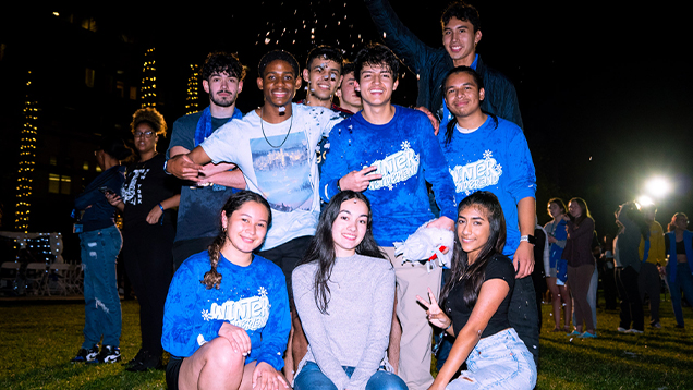 Group of NSU students posing for a picture at an event