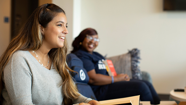 NSU students sitting on a couch