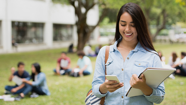 Student using her phone outside of campus