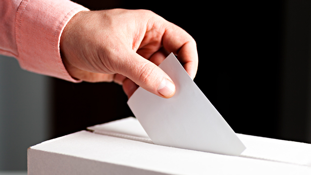 Man putting nomination inside voting box closeup