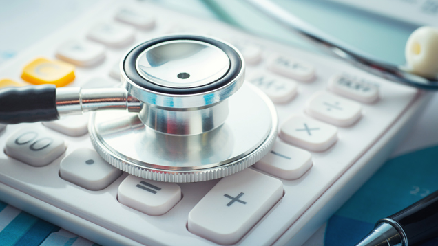 Medical finance insurance concept image with stethoscope and calculator