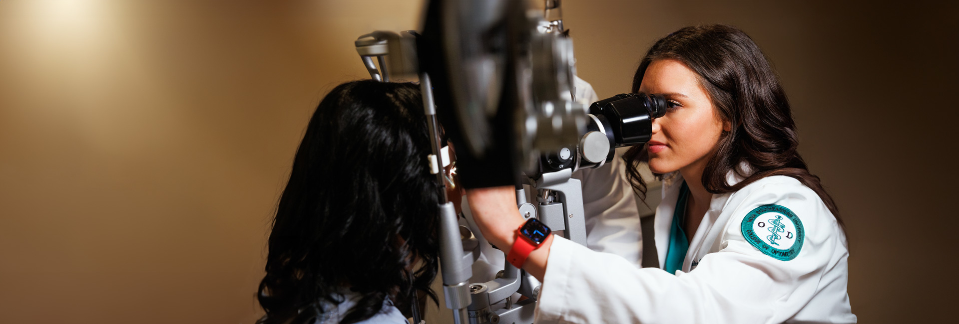 Optometrist student doing eye exam