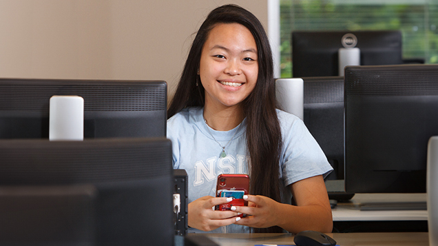 NSU student using mobile phone