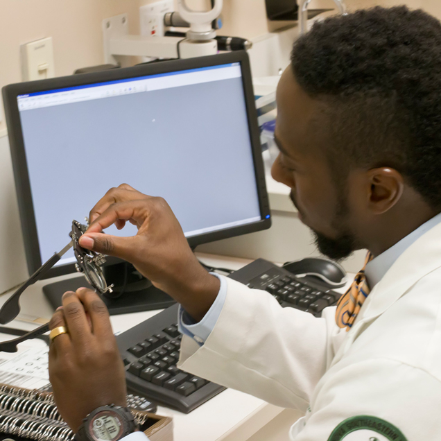 Student working with eye care tools