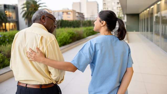 Compassionate health woman guiding senior man