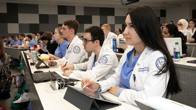 doctor of osteopathic medicine students paying attention to class