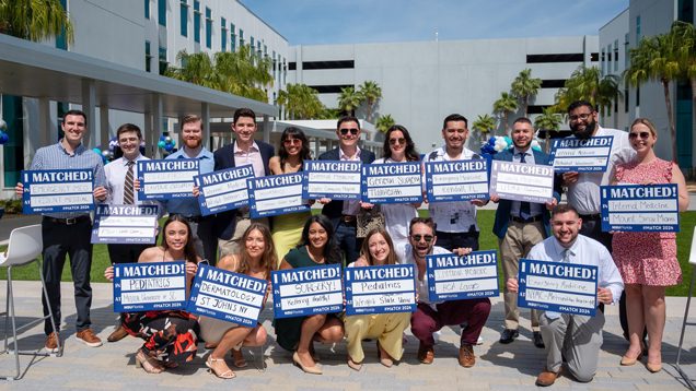 Match day osteopathic group of students holding sign