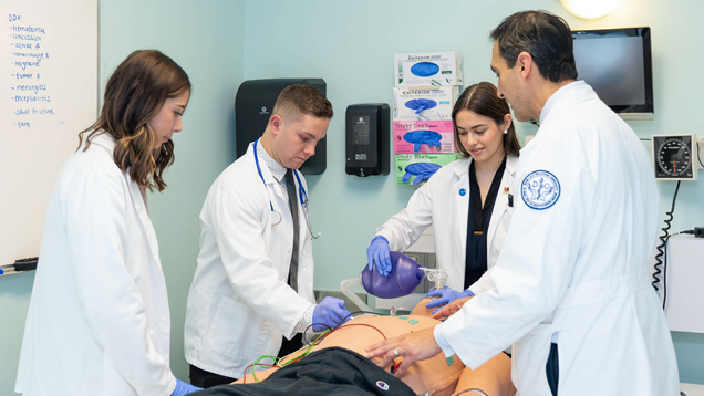 NSU students doing medical procedure dummy