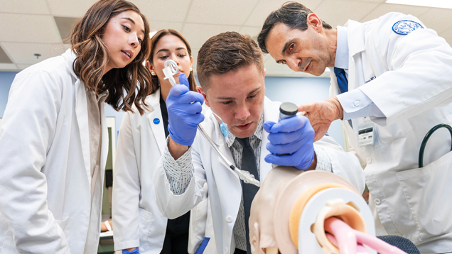 Osteopathic tudents working on dummy