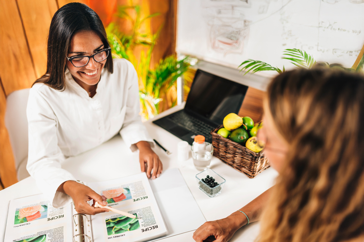 Registered Dietitian Nutritionist and client discussing balanced nutrition plan