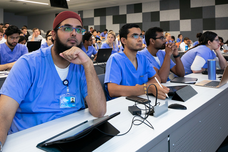 Students listening to lecture on concurrent degrees