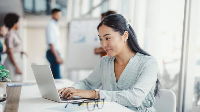 Professional woman using laptop