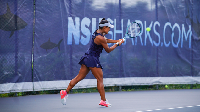 NSU sharks womens tennis player hitting ball