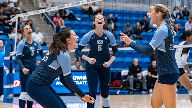 NSU volleyball team celebrating a win