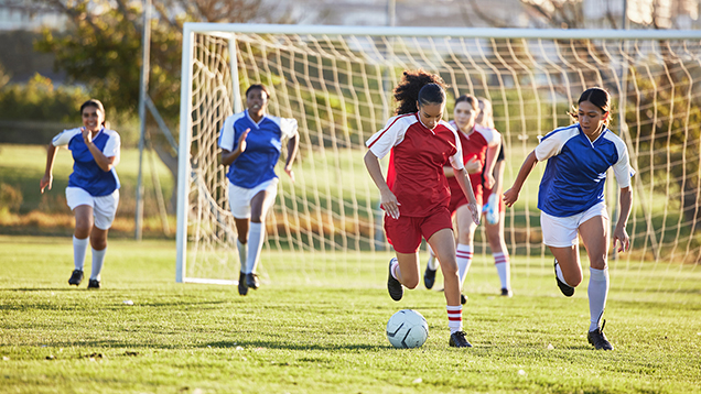 Students playing a soccer game