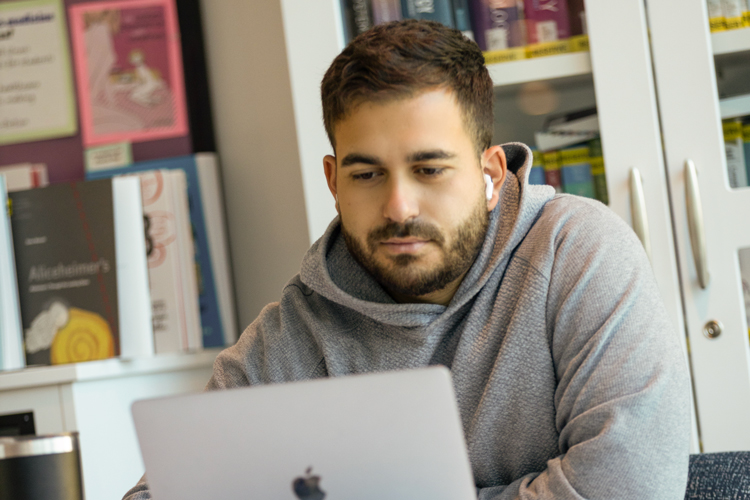 Student concentrated using laptop