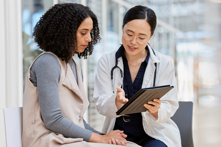 Doctor and patient looking at a digital tablet