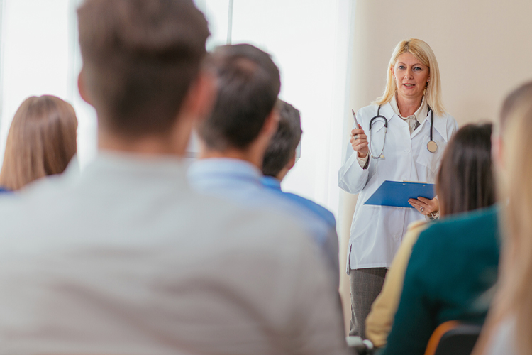 Doctor speaking to a group of participants