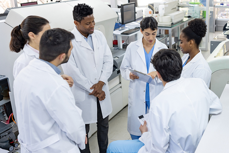 Team of scientists talking in a meeting at the laboratory