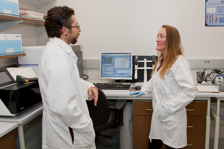 Two scientists talking in an office