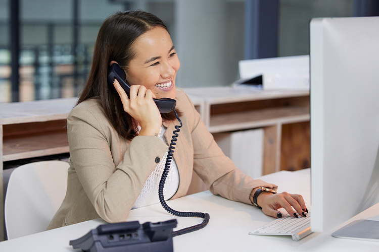 Woman talking on the phone in her office