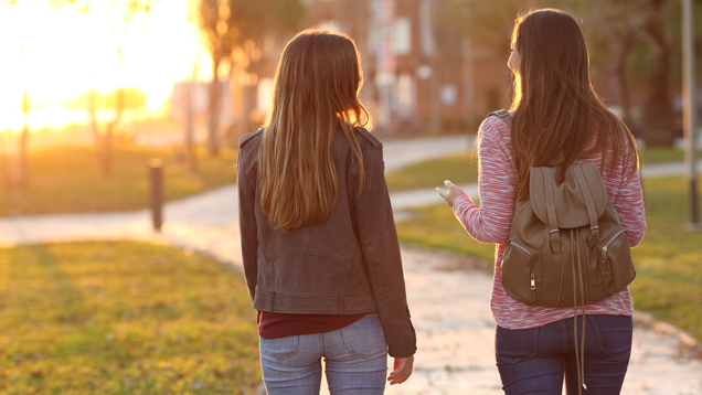 two friends talking outside
