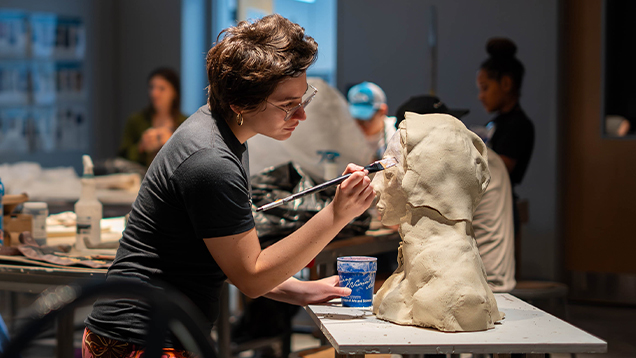 Artist working on a sculpture