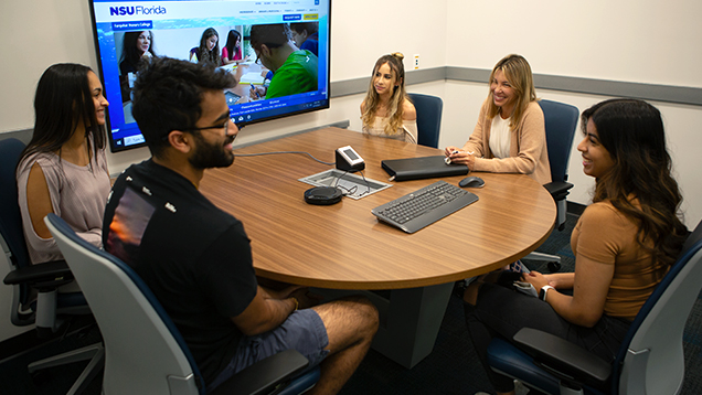 Group of NSU students sitting together and talking