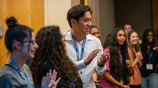 Group of NSU students smiling during the event