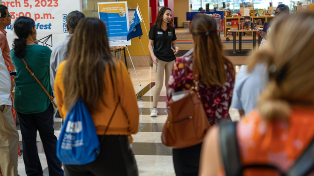 Guide person speaking for high school campus tour