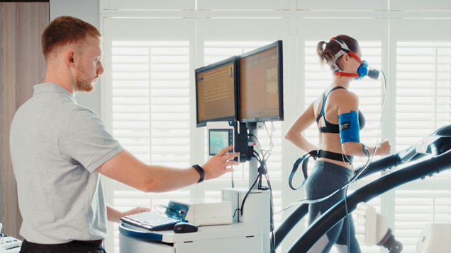 Medical sports doctor doing research on woman athlete