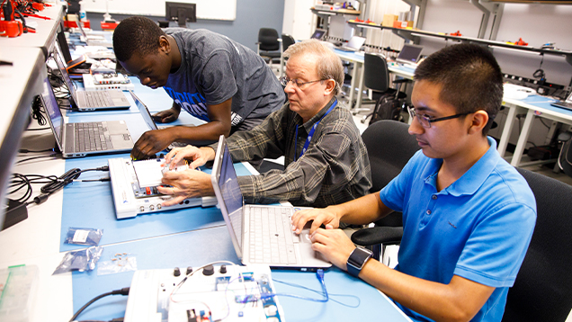 NSU computer engineers working on their computers