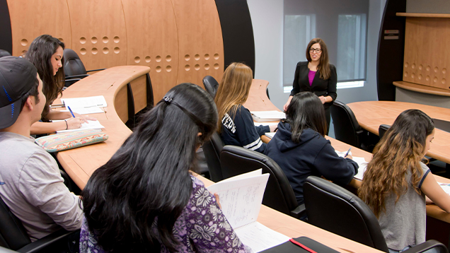 NSU professor and students in a classroom