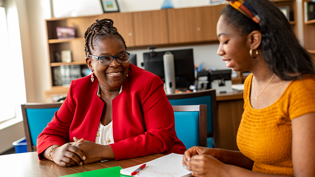 Professor meeting with a student in her office