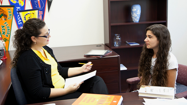 Psychologist speaking to a student